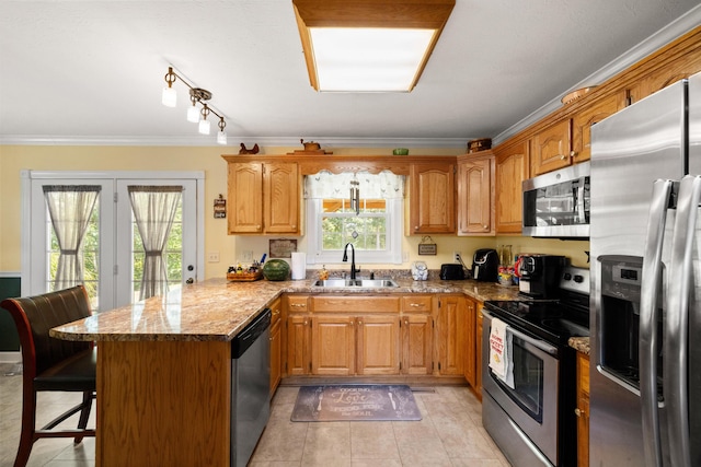 983 Short Town Rd, Liberty, KY 42539 - kitchen with a kitchen breakfast bar, ornamental molding, a sink, a peninsula, and appliances with stainless steel finishes