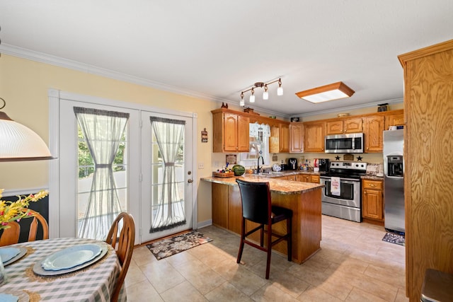 983 Short Town Rd, Liberty, KY 42539 - kitchen featuring ornamental molding, a peninsula, a sink, and appliances with stainless steel finishes