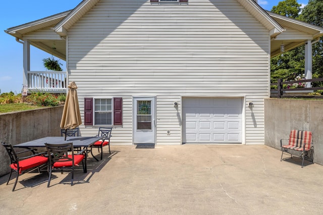983 Short Town Rd, Liberty, KY 42539 - back of property featuring outdoor dining area, a garage, and a patio area