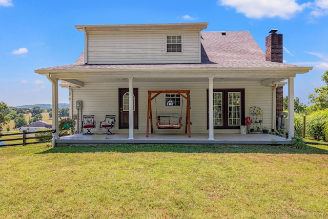 983 Short Town Rd, Liberty, KY 42539 - rear view of house with a chimney, fence, french doors, and a yard
