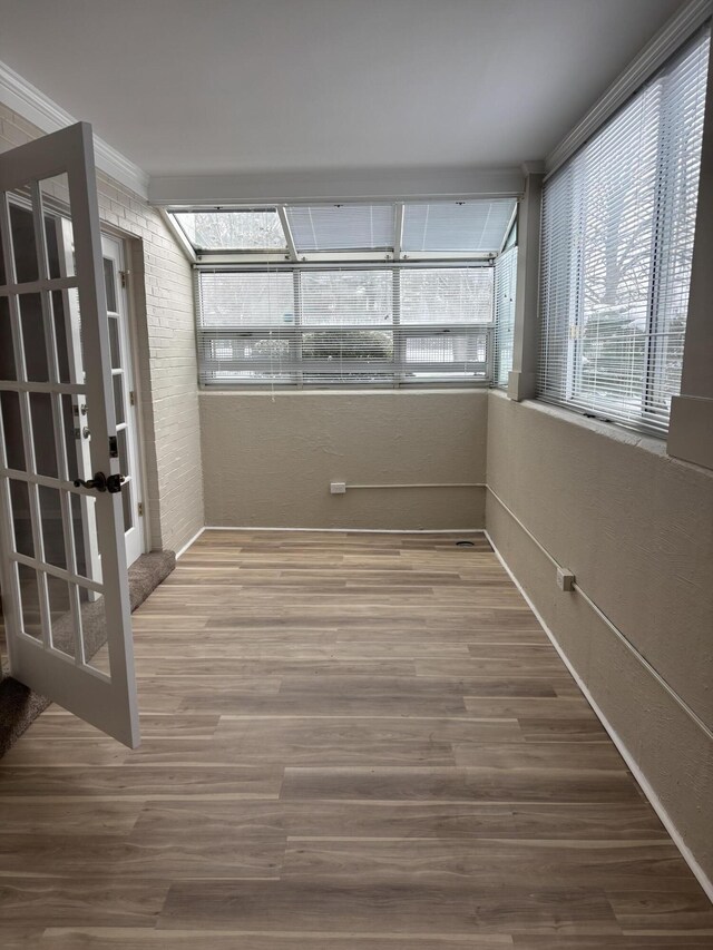 empty room with ornamental molding, a raised ceiling, and carpet floors