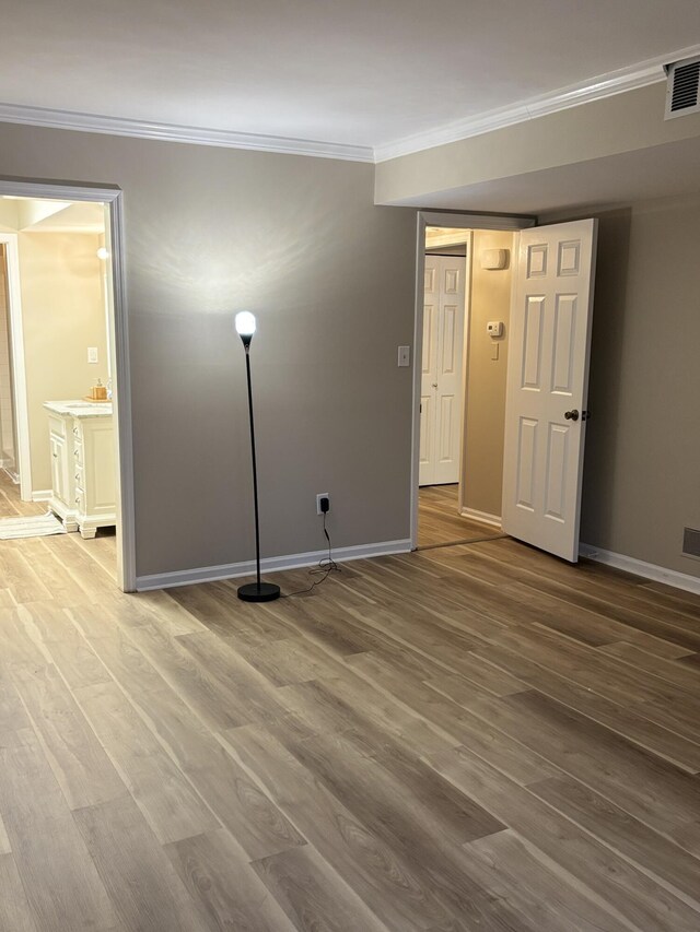 carpeted spare room featuring ornamental molding