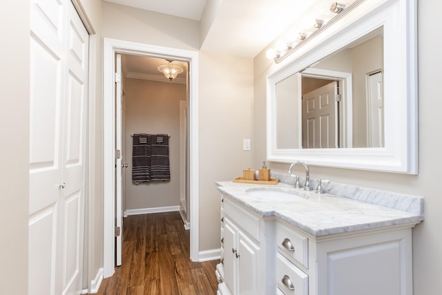 bathroom with hardwood / wood-style flooring and vanity