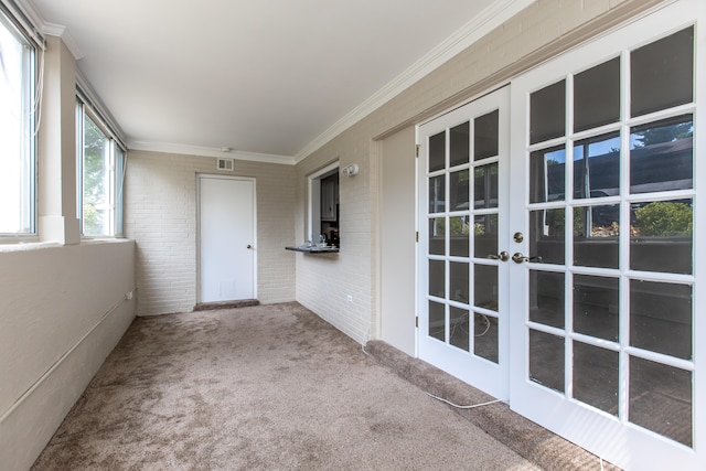 unfurnished sunroom featuring french doors