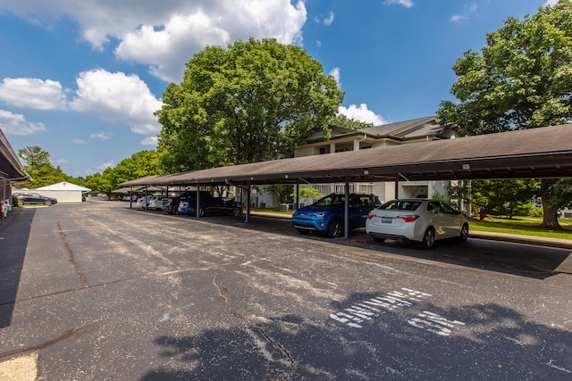 view of parking / parking lot featuring a carport