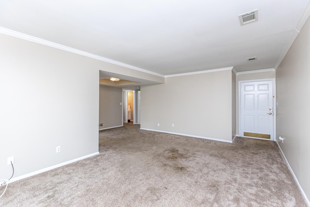 carpeted spare room with crown molding