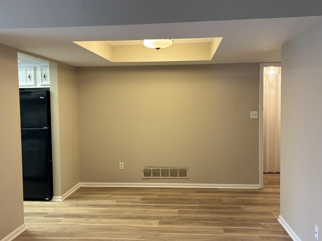 carpeted empty room featuring french doors and crown molding