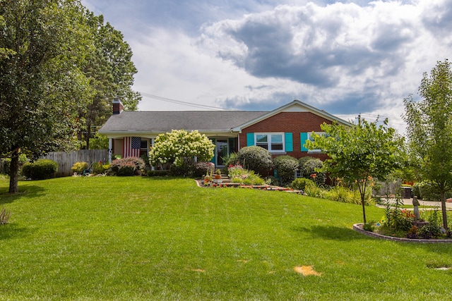 ranch-style home with a front lawn