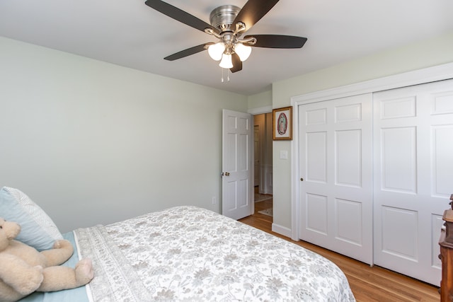 bedroom featuring a closet, ceiling fan, and hardwood / wood-style floors