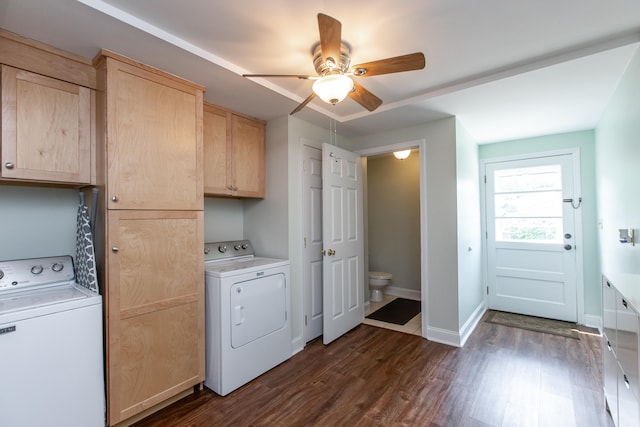 laundry room featuring cabinets, separate washer and dryer, dark hardwood / wood-style flooring, and ceiling fan