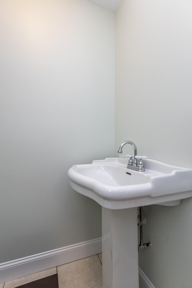 bathroom with tile patterned floors