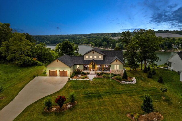 view of front of home featuring a garage and a lawn