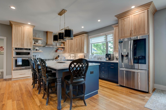 kitchen with open shelves, wall chimney range hood, light brown cabinetry, and stainless steel appliances