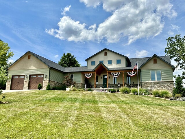 view of front of property featuring a garage and a front yard