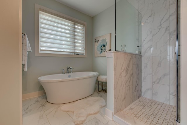 bathroom with a marble finish shower, a soaking tub, marble finish floor, and baseboards