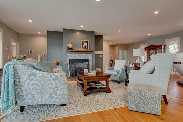 living area featuring recessed lighting and light wood finished floors