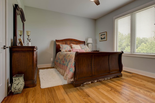 bedroom featuring light wood-style flooring, baseboards, and visible vents