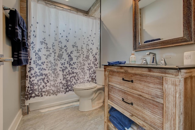 bathroom featuring curtained shower, toilet, and vanity