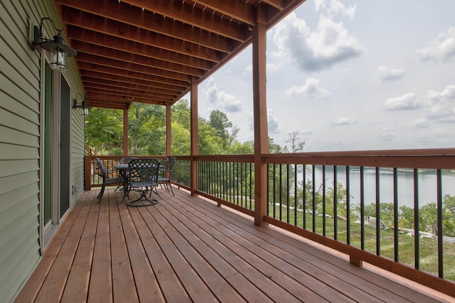 wooden terrace featuring outdoor dining area