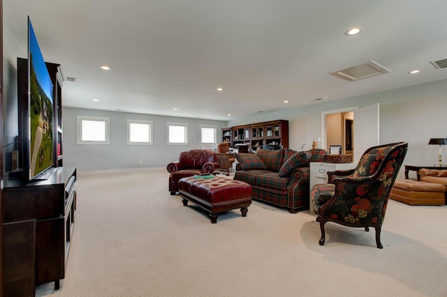 living room featuring attic access, recessed lighting, visible vents, and carpet floors