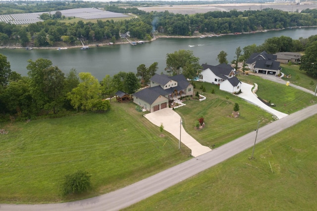 birds eye view of property with a water view