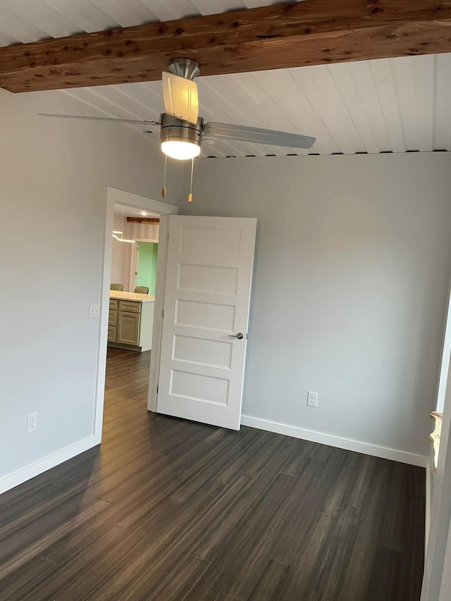 empty room with ceiling fan, dark hardwood / wood-style floors, wood ceiling, and beam ceiling