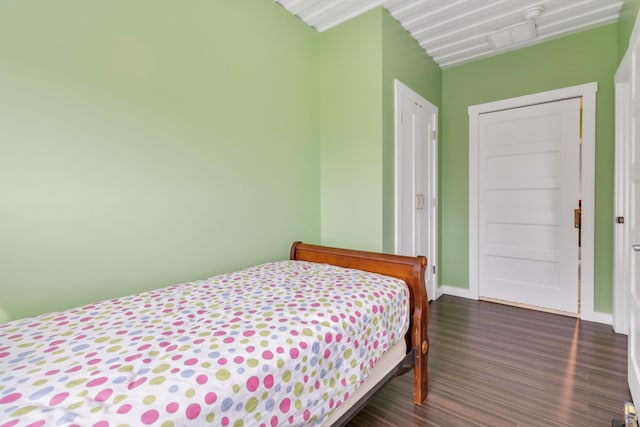 bedroom featuring dark hardwood / wood-style flooring