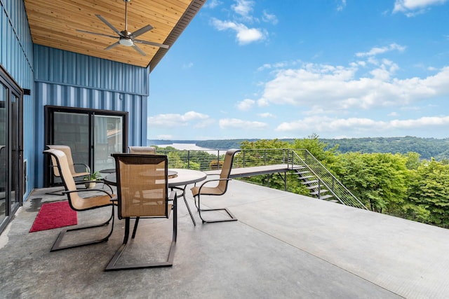 view of patio / terrace featuring ceiling fan and a balcony