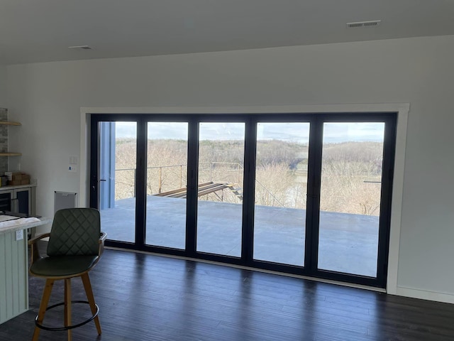 doorway to outside with dark hardwood / wood-style floors