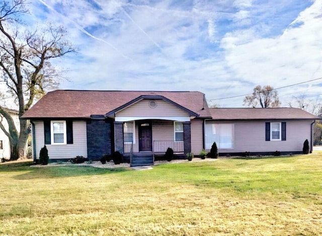 ranch-style house with a front lawn and covered porch