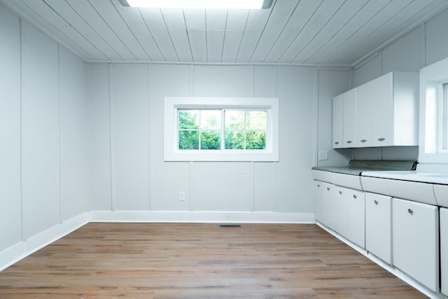 interior space with wooden ceiling and light wood-type flooring