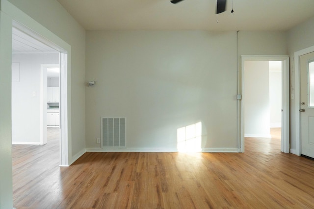 unfurnished room with ceiling fan and light hardwood / wood-style flooring