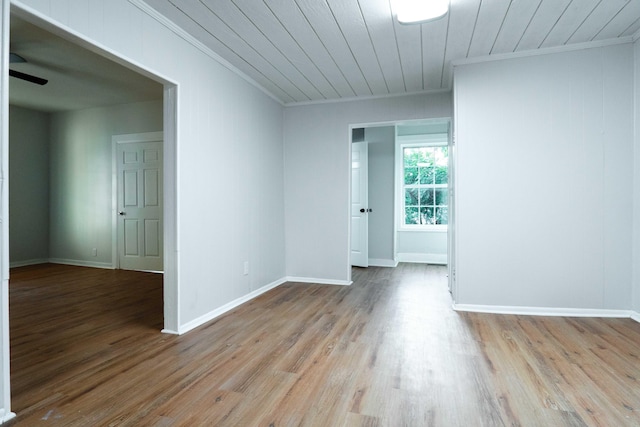 unfurnished room with ornamental molding, wooden ceiling, and light wood-type flooring