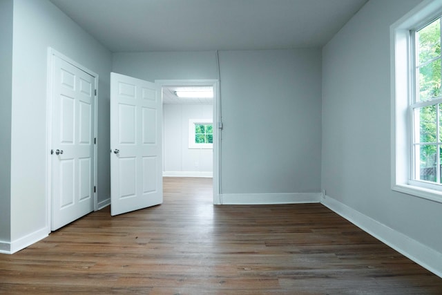 empty room featuring dark wood-type flooring