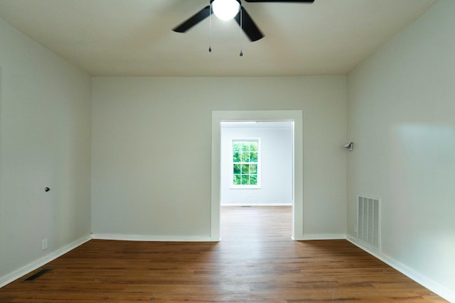 spare room with wood-type flooring and ceiling fan