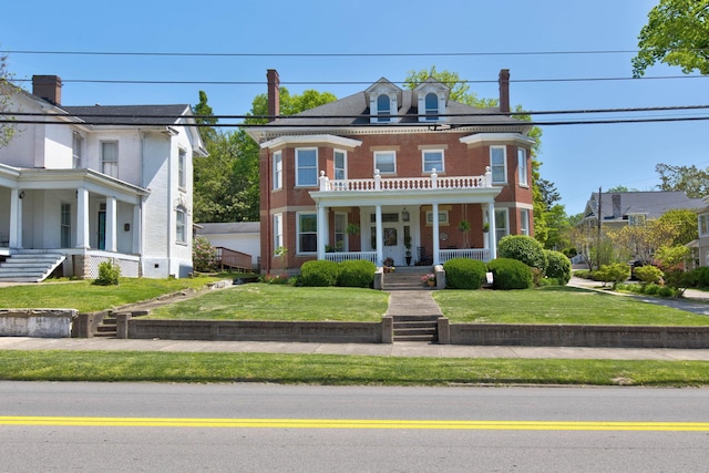 view of front of house with a front lawn and a porch