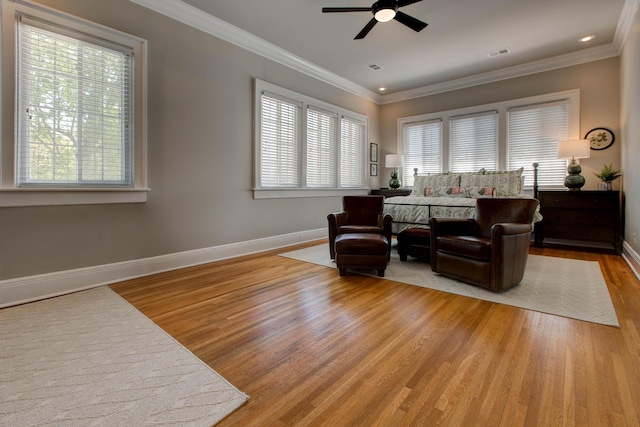 sitting room featuring ornamental molding, a healthy amount of sunlight, visible vents, and light wood-style floors