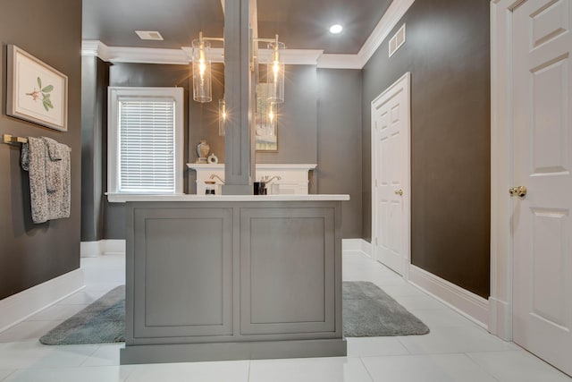 bathroom with ornamental molding, tile patterned flooring, visible vents, and baseboards