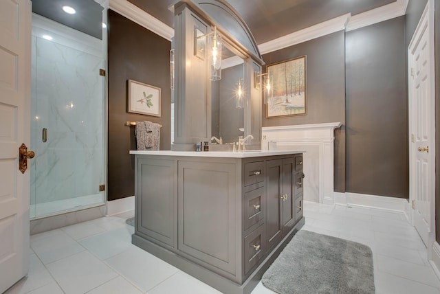 bathroom with a sink, a marble finish shower, tile patterned floors, double vanity, and crown molding