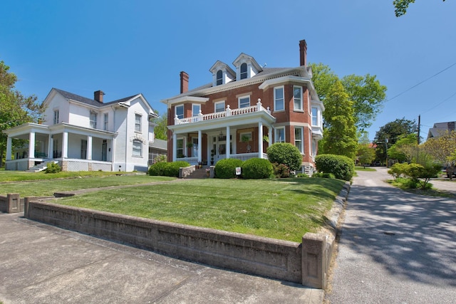 view of front of property with a porch and a front yard