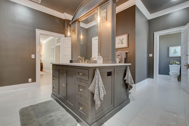 bathroom featuring baseboards, toilet, and crown molding