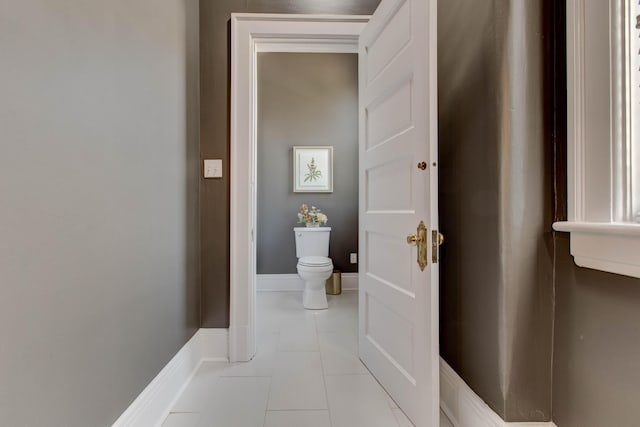 bathroom featuring toilet and tile patterned floors