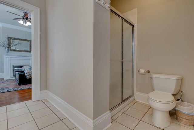 ensuite bathroom with ensuite bathroom, a stall shower, and tile patterned floors