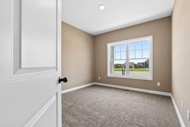 unfurnished room with carpet floors