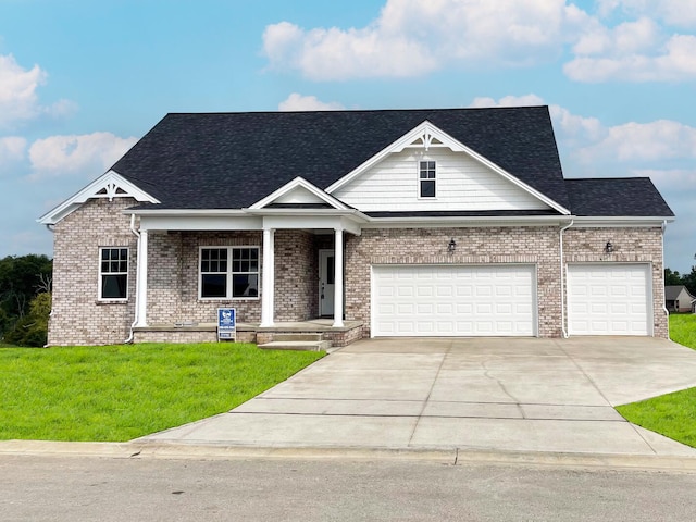 craftsman inspired home featuring a porch and a front yard