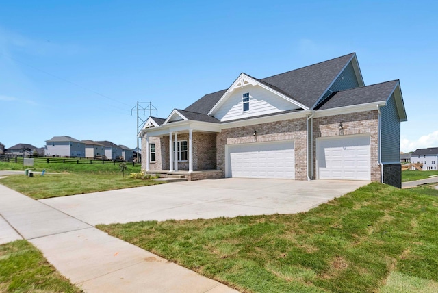 view of front of home featuring a garage and a front lawn