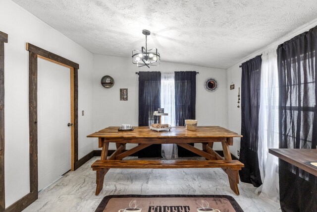 4743 Shoemaker Rdg, Zoe, KY 41397 - dining space featuring an inviting chandelier, marble finish floor, baseboards, and a textured ceiling