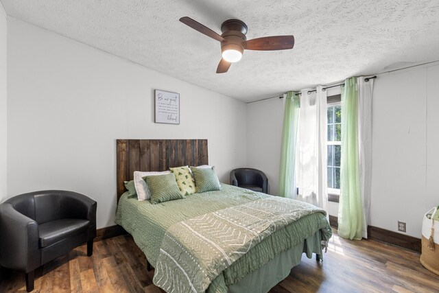 bedroom featuring a textured ceiling, ceiling fan, and wood-type flooring