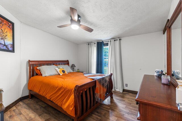 bedroom with a textured ceiling, hardwood / wood-style flooring, and ceiling fan