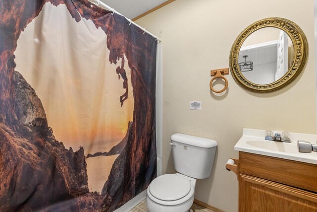 bathroom with vanity, tile patterned flooring, and toilet